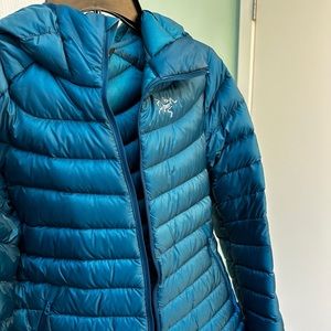 Warm down puffy. Worn only 4 times, like new condition (no defects or stains).